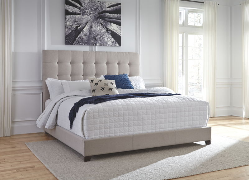 Dolante Upholstered Bed in Beige - Ashley Furniture
